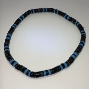 Men’s black and blue necklace